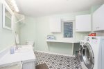 Main level laundry room and half bathroom